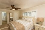 This large master bedroom has an en-suite bathroom, large flatscreen TV and a large walk-in closet. 